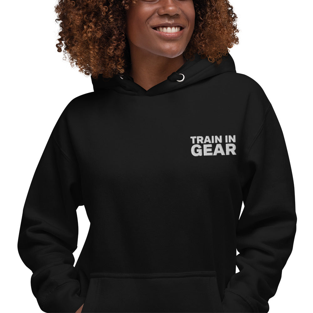 Train in Gear Embroidered Black Hoodie. Top left embroidery in white with our red uncivil spear embroidered on the left wrist.