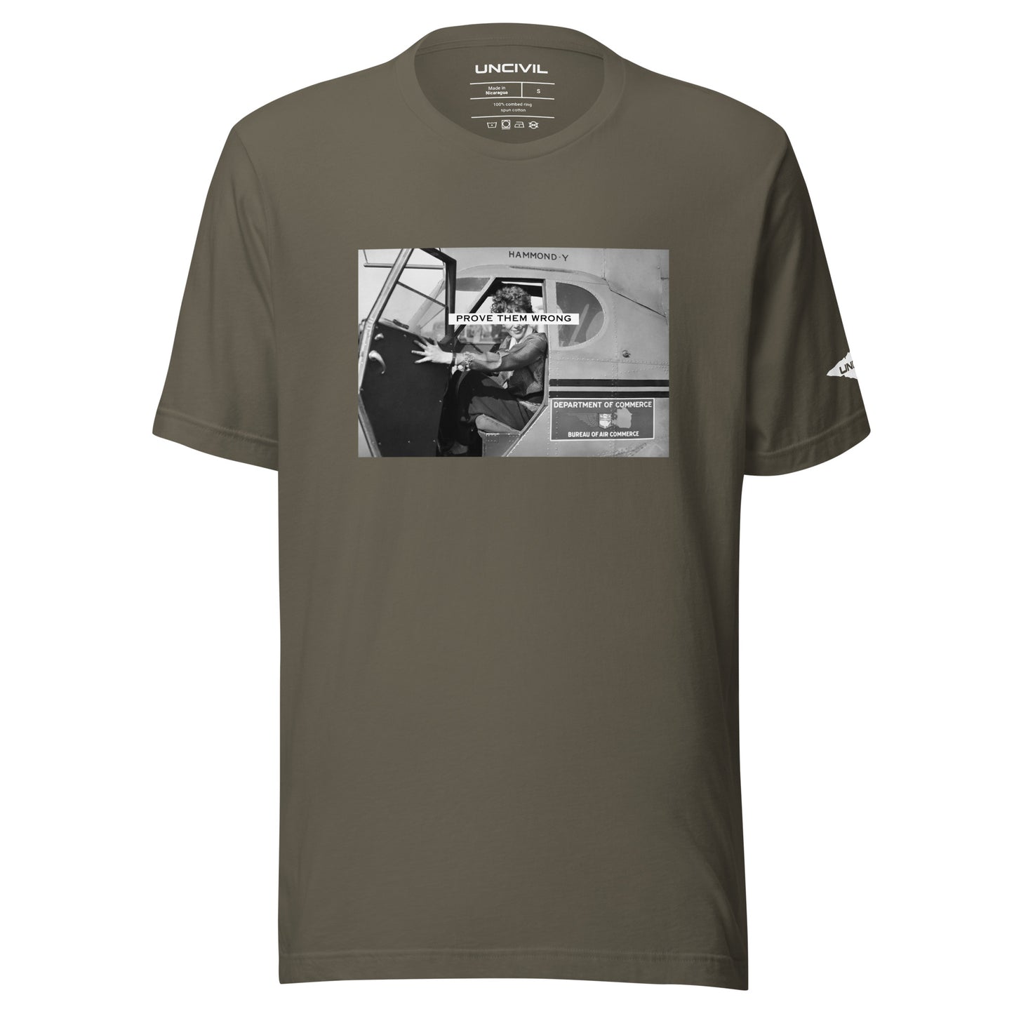 Prove Them Wrong graphic t-shirt features a graphic of Amelia Earhart on a plane in black and white. Army green shirt.