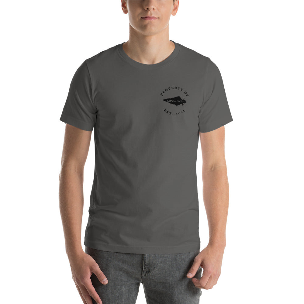 UNCIVIL Apparel Established 2015 shirt features our Uncivil Spear with the words "property of uncivil Est. 2015 on the front left chest. Asphalt color shirt.