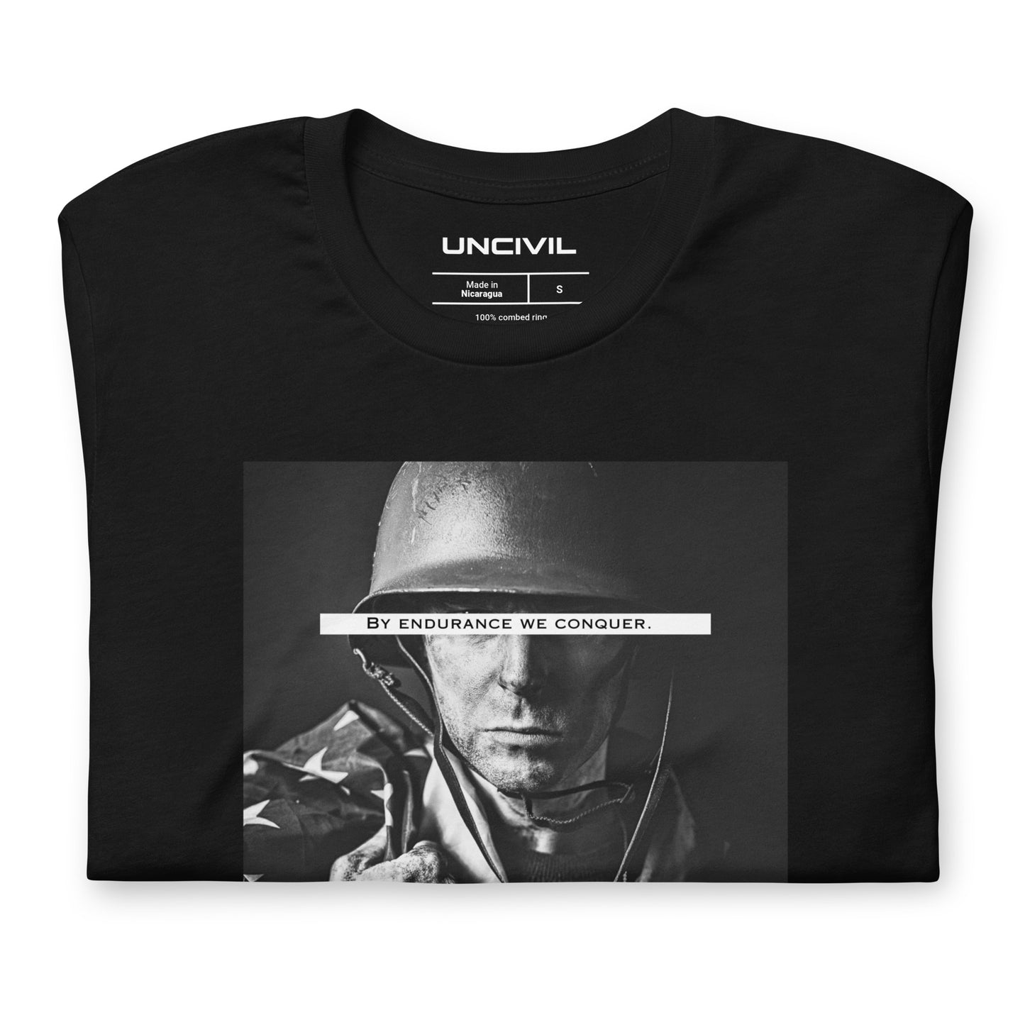 Our Black "By Endurance we Conquer" shirt features a soldier holding the American Flag. A reminder that through sheer determination, resilience, and the willingness to face adversity head-on, people can overcome even the most challenging and daunting situations.