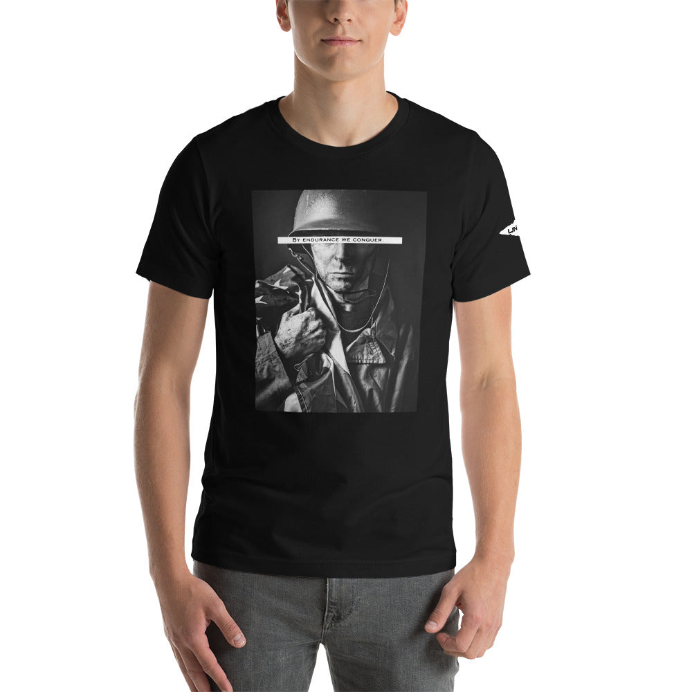 Our Black "By Endurance we Conquer" shirt features a soldier holding the American Flag. A reminder that through sheer determination, resilience, and the willingness to face adversity head-on, people can overcome even the most challenging and daunting situations.