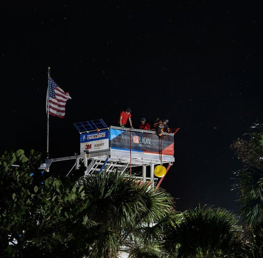 Firefighters stand at the top of the tower where they will hoist at the 2023 Firefighter Challenge World Championship