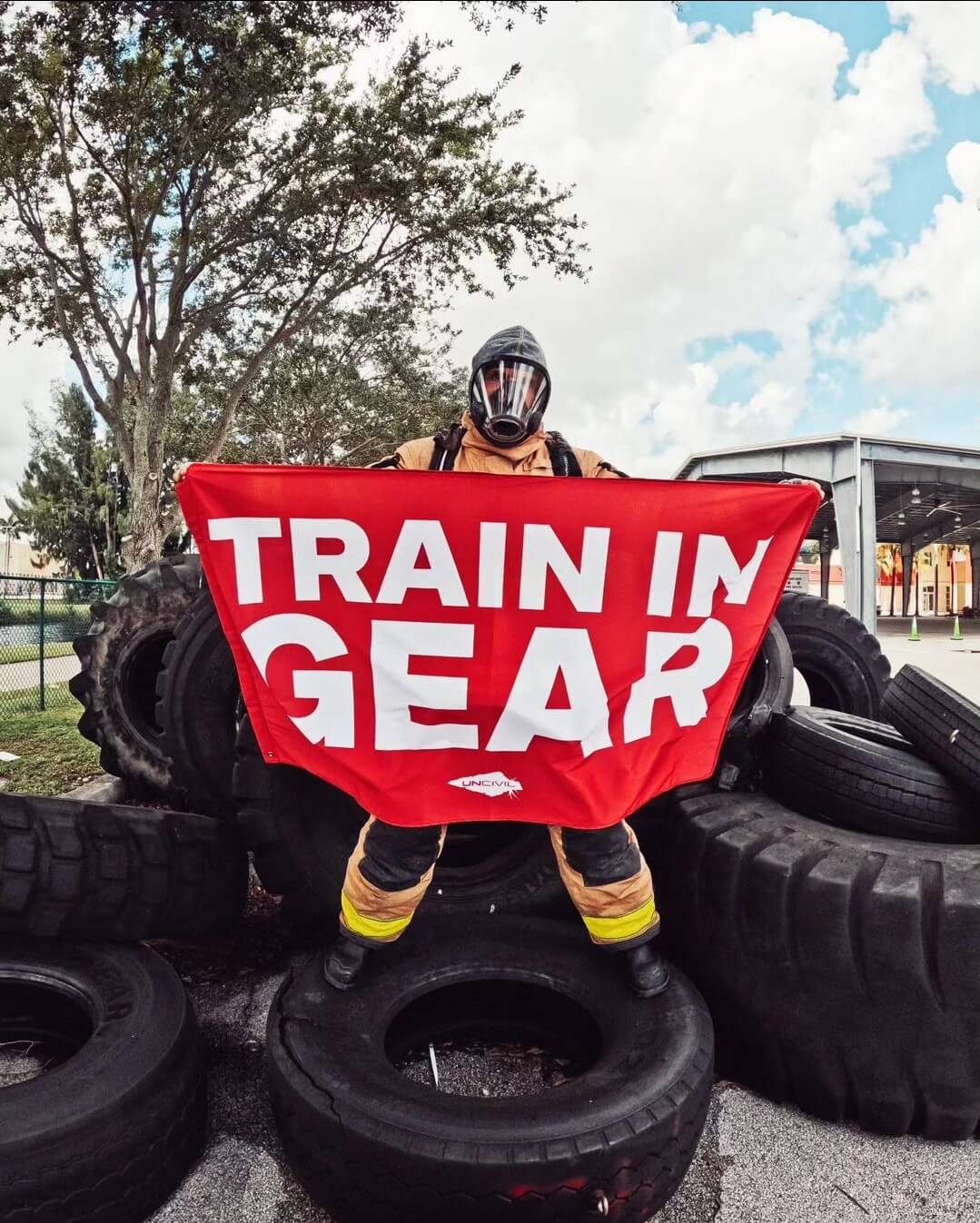 Train in Gear Flag 5x3 flag. Made for Firefighters, military, and first responders. Red and White flag with the UNCIVIL spear.