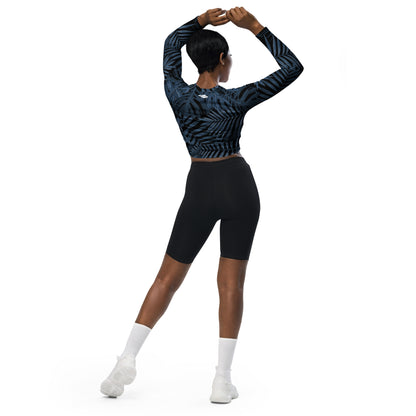 Steel Blue Palms long-sleeve crop top for women is made of recycled polyester and elastane, making it an eco-friendly choice for swimming, sports, or athleisure. UPF 50+.