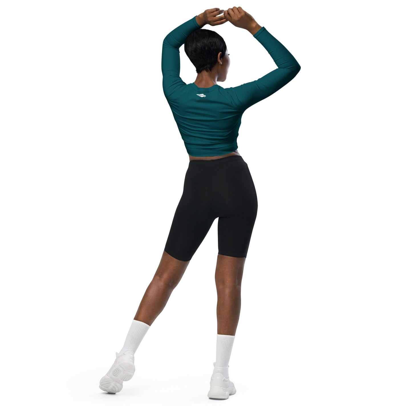 Teal long-sleeve crop top for women is made of recycled polyester and elastane, making it an eco-friendly choice for swimming, sports, or athleisure. UPF 50+.