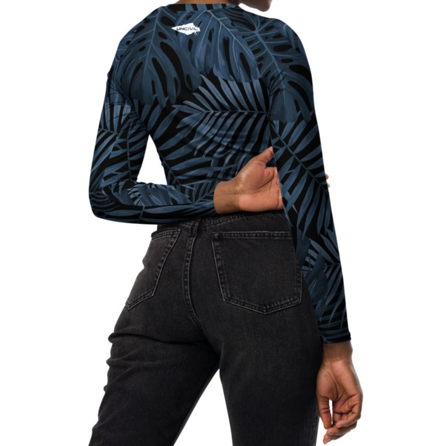 Steel Blue Palms long-sleeve crop top for women is made of recycled polyester and elastane, making it an eco-friendly choice for swimming, sports, or athleisure. UPF 50+.