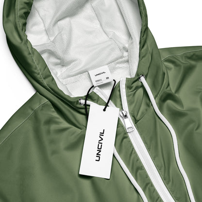 Army Green UNCIVIL cropped windbreaker is lightweight, waterproof, and suitable for every kind of adventure. Features include side-slit pockets, breathable mesh lining, and adjustable drawcords on the hood and waist.