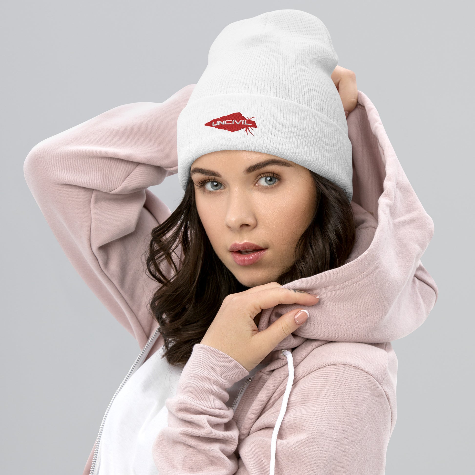 Our UNCIVIL Gold cuffed beanie is a snug, form-fitting beanie for men or women. Offered in White with our Red UNCIVIL Spear. 