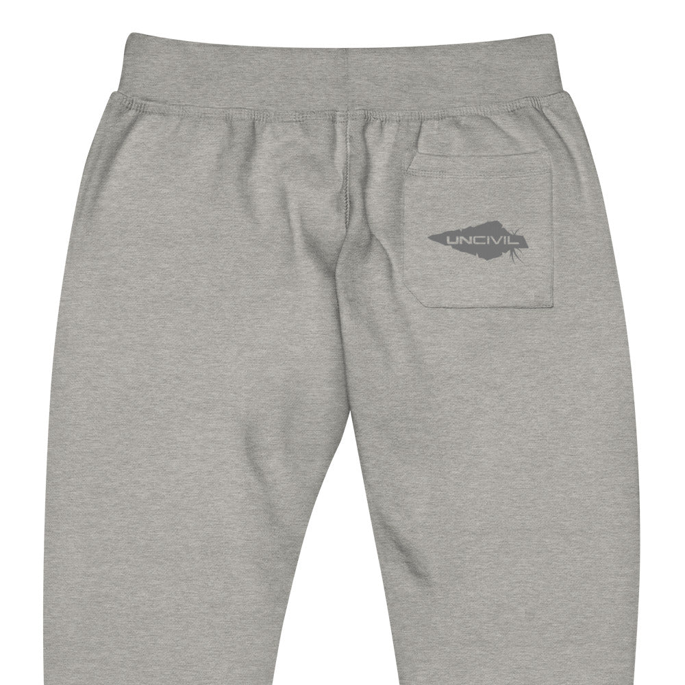Carbon Grey sweatpants, UNCIVIL on front left leg and UNCIVIL patch on the back right pocket.
