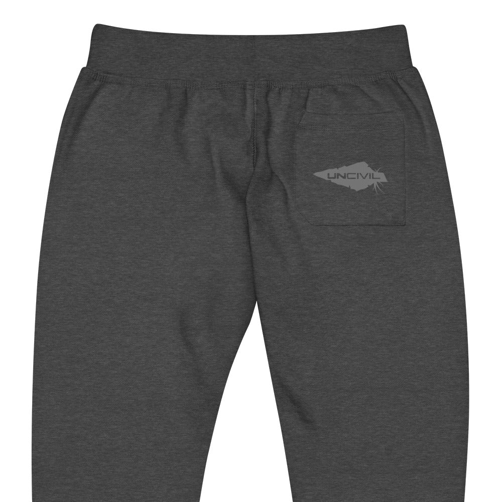 Charcoal grey sweatpants, UNCIVIL on front left leg and UNCIVIL patch on the back right pocket.