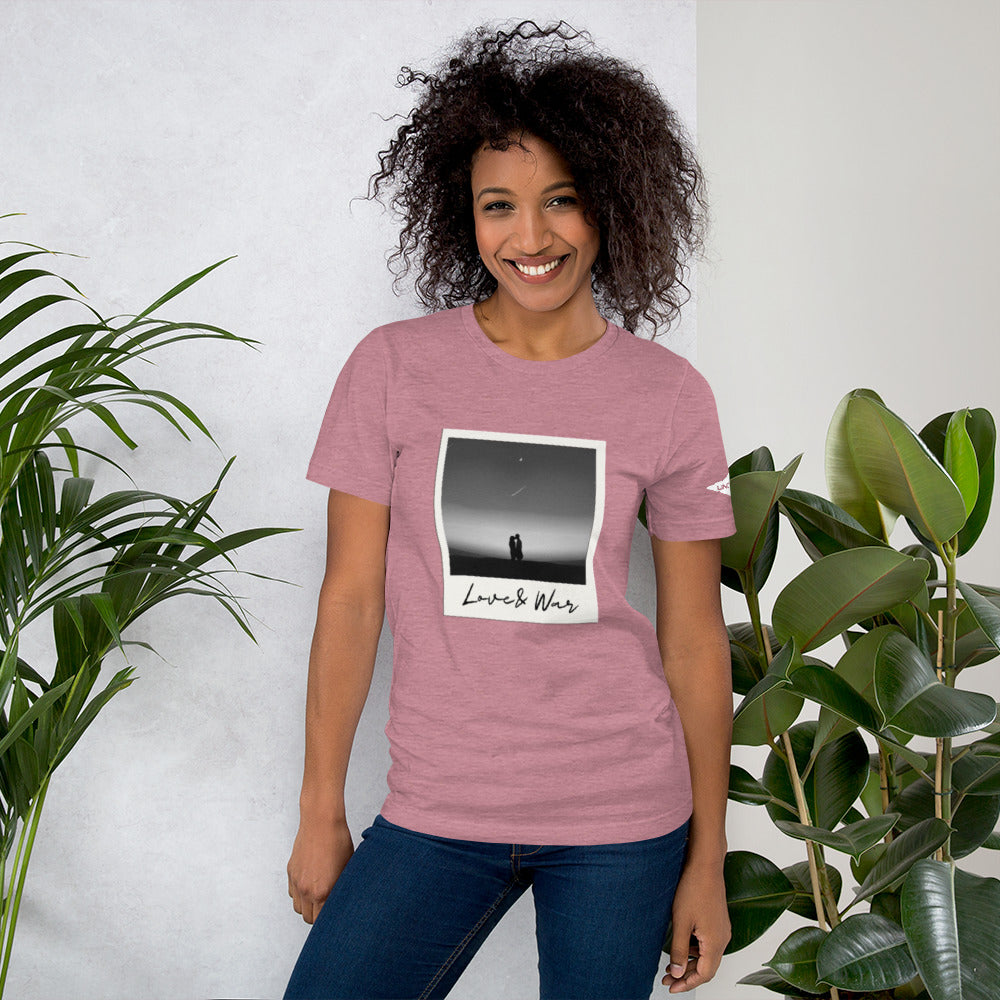 Love and War shirt. Featuring a Polaroid photo of a couple in black and white. Heather pink women's shirt.